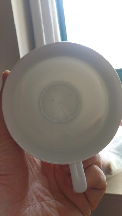 古玩陶瓷執杯真品鑒賞圖
