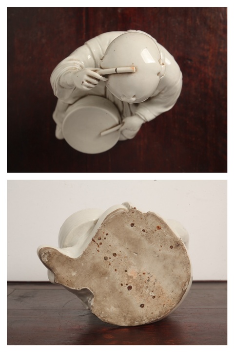 古玩陶瓷擊鼓童子塑像真品鑒賞圖