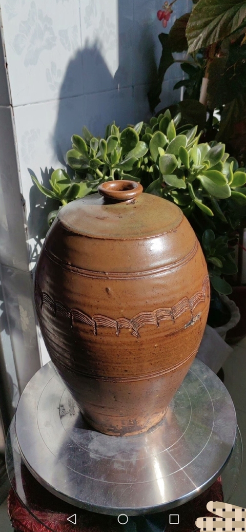古玩陶瓷褐釉刻水波紋梅瓶真品鑒賞圖