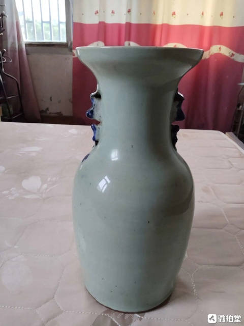 古玩陶瓷豆青釉青花花鳥紋盤口瓶真品鑒賞圖