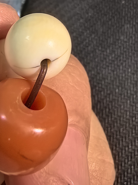 古玩玉器珍貴材質十八籽手持真品鑒賞圖