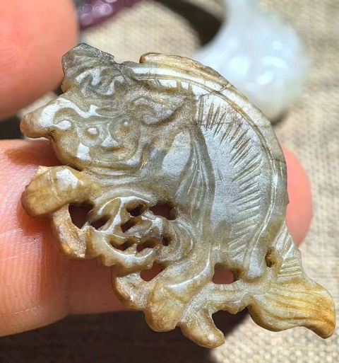 古玩雜項(xiàng)獅子滾繡球花片真品鑒賞圖