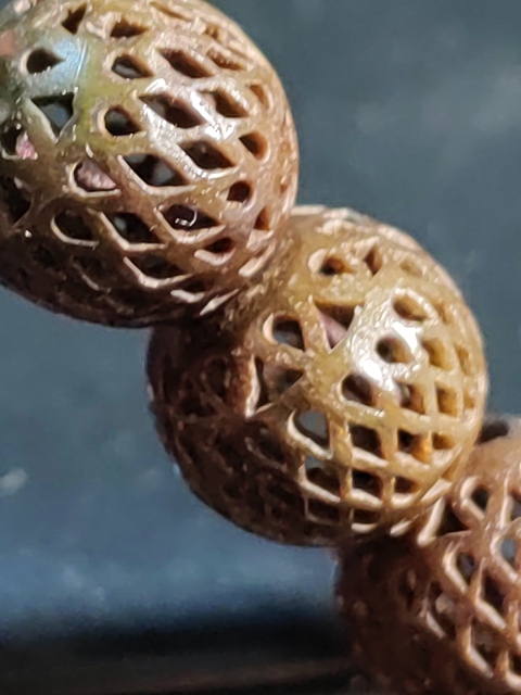 古玩玉器角質鏤空珠子手串真品鑒賞圖