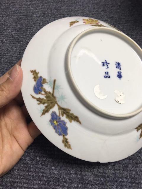 古玩陶瓷花間龍紋粉彩盤真品鑒賞圖
