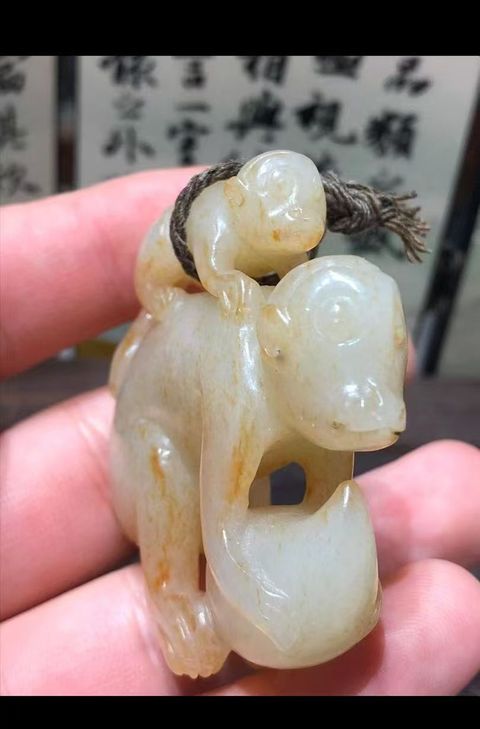 古玩玉器和田玉雕“擊鼓童子”真品鑒賞圖