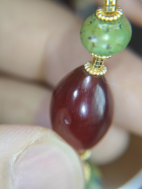 古玩雜項橄欖瑪瑙珠子真品鑒賞圖