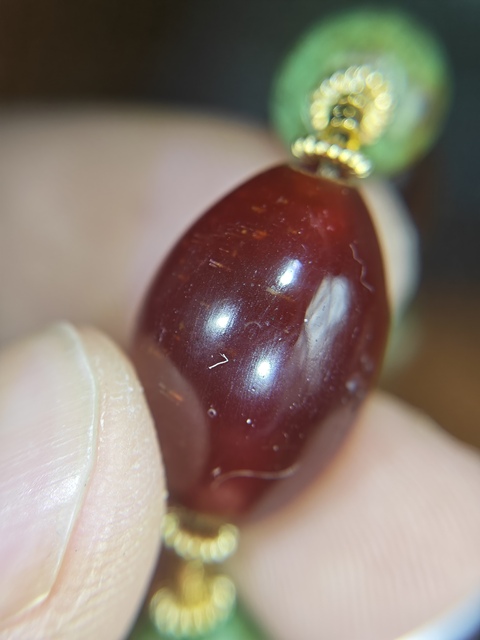 古玩雜項橄欖瑪瑙珠子真品鑒賞圖