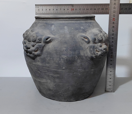 古玩陶瓷黑陶獸頭罐真品鑒賞圖