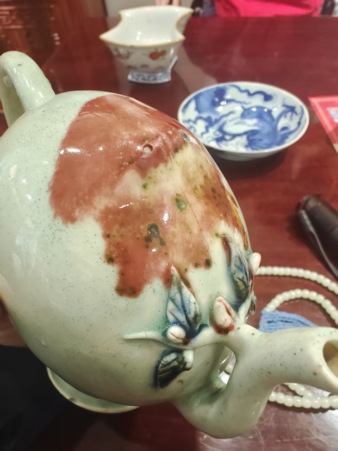 古玩陶瓷乾隆釉下三彩倒流壺真品鑒賞圖