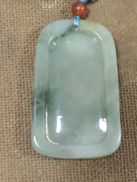 古玩玉器翡翠糯種飄花牛掛牌真品鑒賞圖