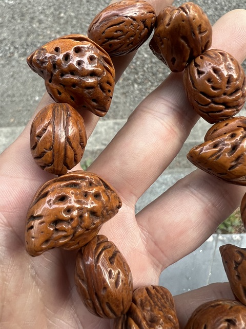 古玩雜項桃核手串真品鑒賞圖